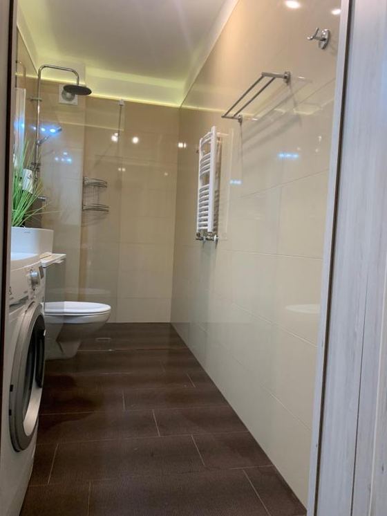 Bathroom — shower and washing machine